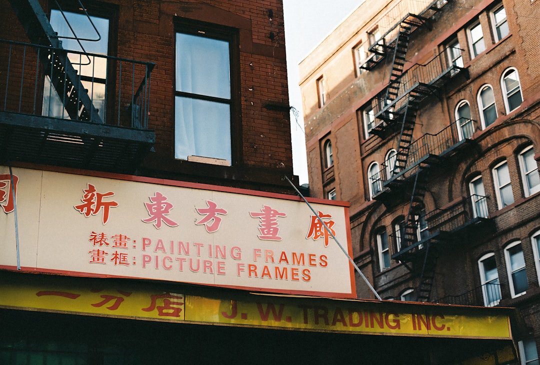 a building with a sign that says painting frames picture frames